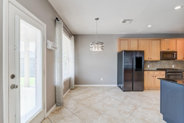 kitchen featuring baseboards, visible vents, decorative backsplash, dark countertops, and black appliances