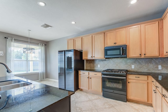 kitchen featuring light brown cabinets, a sink, visible vents, black gas stove, and smart refrigerator