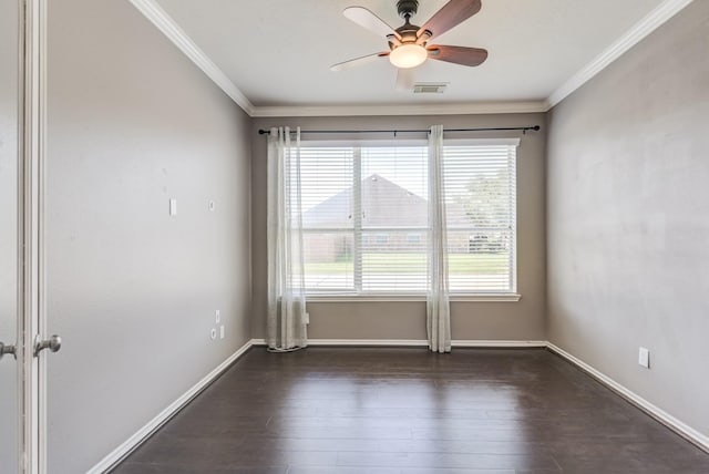 unfurnished room with dark wood-style floors, baseboards, a ceiling fan, and crown molding