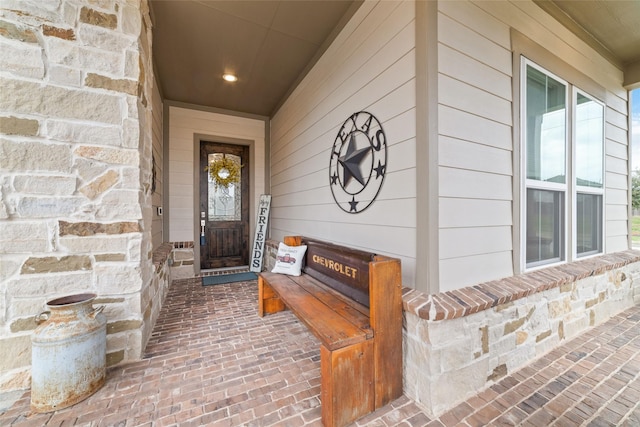 property entrance with stone siding