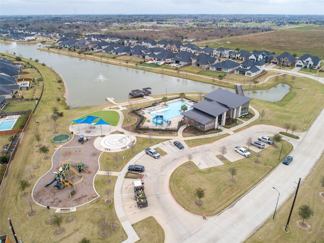 bird's eye view with a water view and a residential view