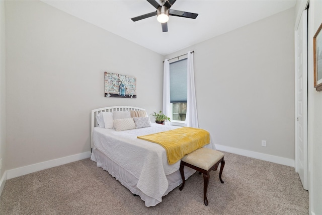 carpeted bedroom featuring ceiling fan and baseboards