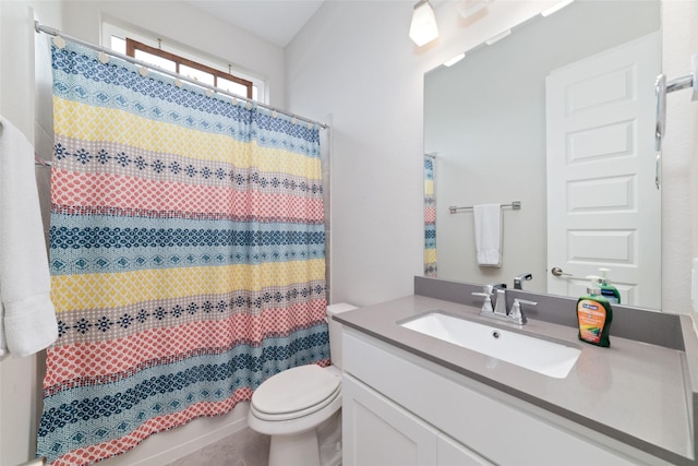 bathroom with vanity, toilet, and a shower with curtain