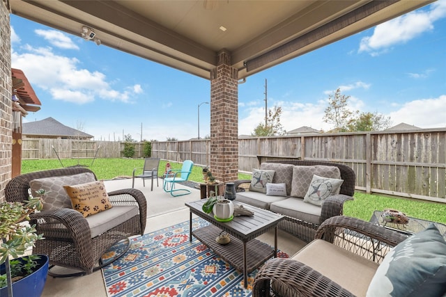 view of patio featuring a fenced backyard and outdoor lounge area