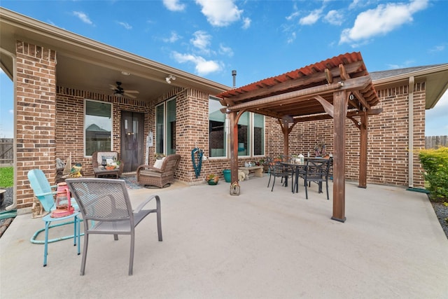 view of patio featuring outdoor dining area, a ceiling fan, and a pergola