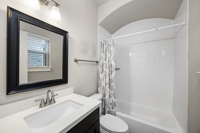 full bathroom with toilet, shower / bath combo with shower curtain, and vanity