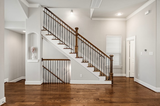 entrance foyer with baseboards, ornamental molding, wood finished floors, stairs, and recessed lighting