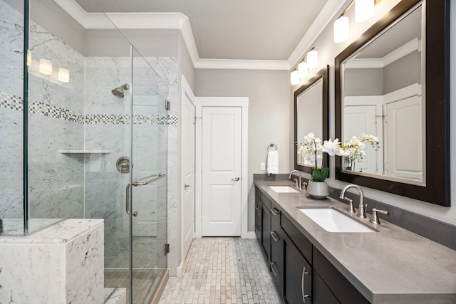 full bathroom featuring crown molding, a stall shower, a sink, and double vanity