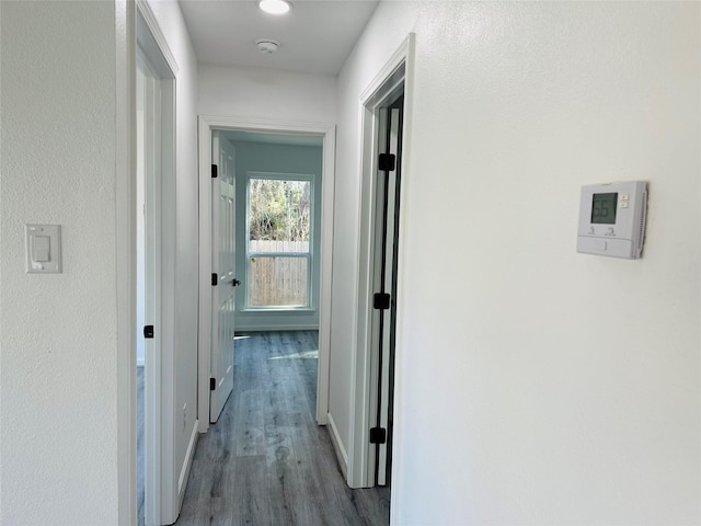 corridor featuring wood finished floors