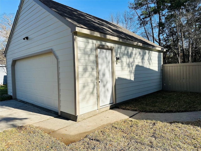 view of outbuilding featuring an outbuilding and fence