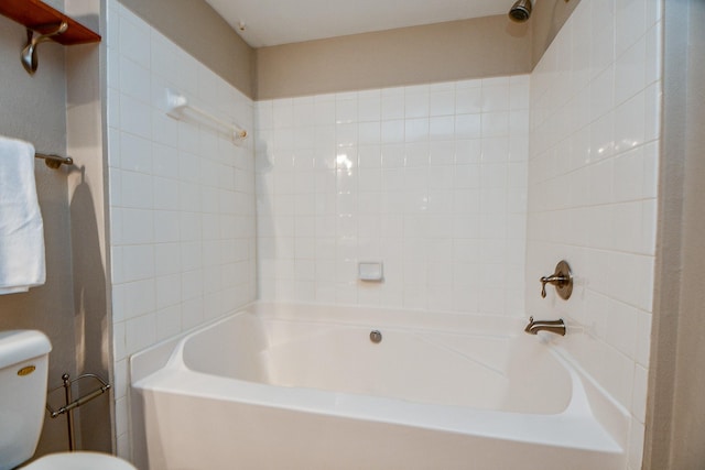 bathroom with shower / washtub combination and toilet