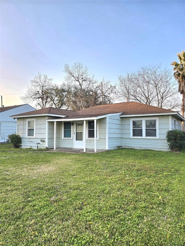 ranch-style house with a front lawn