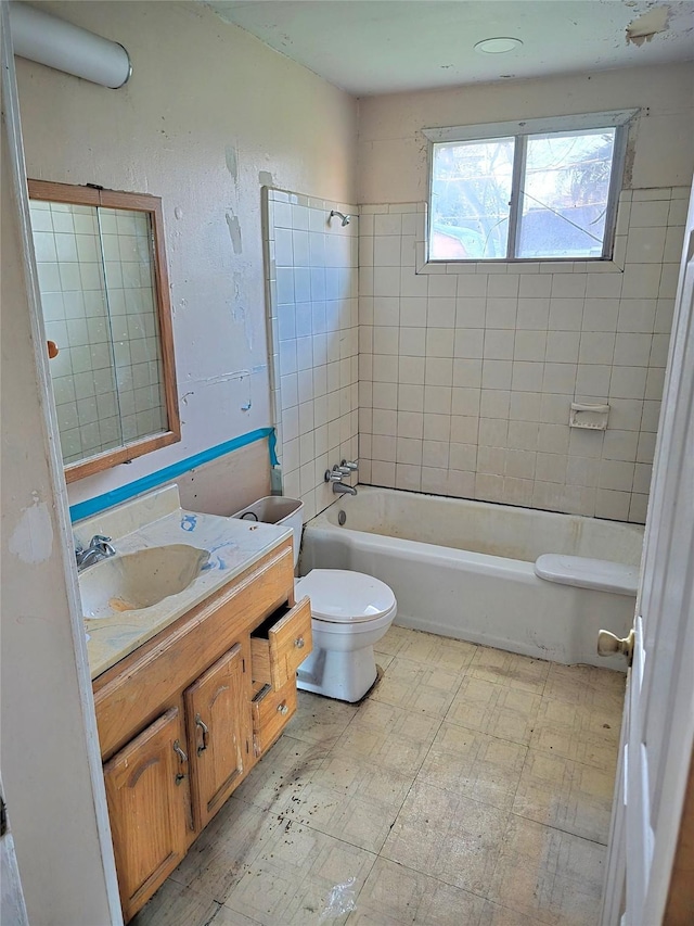 full bathroom featuring bathing tub / shower combination, vanity, toilet, and tile patterned floors