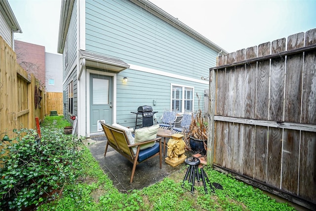 exterior space featuring a patio area and a fenced backyard