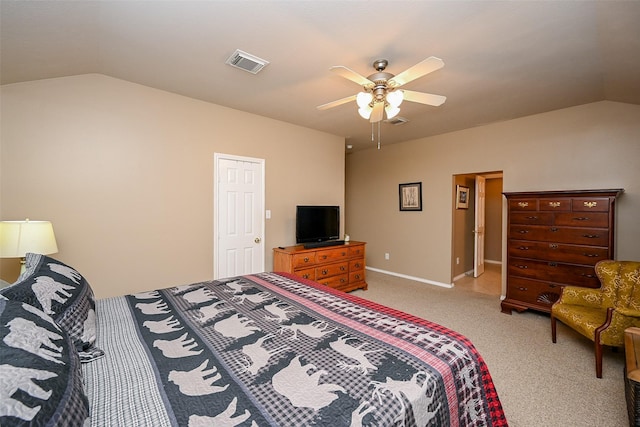 carpeted bedroom with vaulted ceiling, ceiling fan, and visible vents