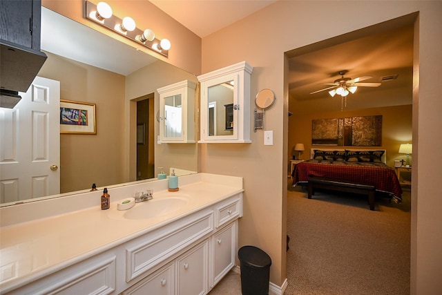 bathroom with visible vents, a ceiling fan, and vanity