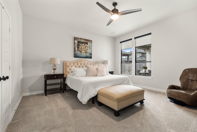 bedroom with carpet flooring, a ceiling fan, and baseboards