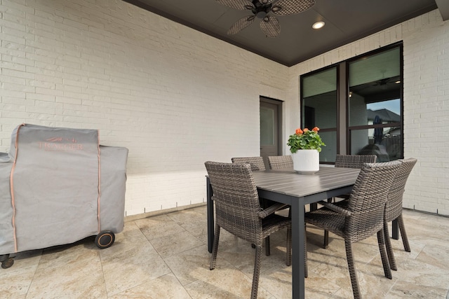 view of patio with ceiling fan and outdoor dining area