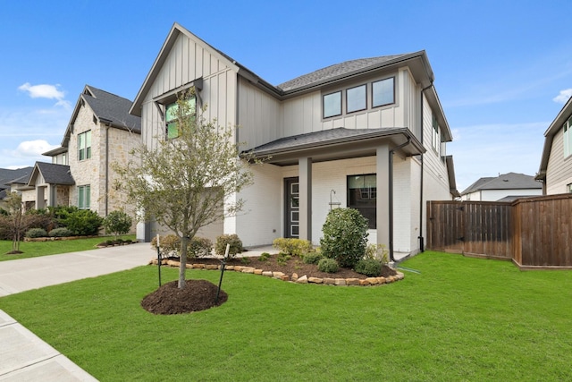 modern farmhouse style home with an attached garage, brick siding, board and batten siding, and concrete driveway