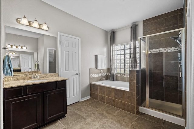 bathroom with a stall shower, tile patterned flooring, vanity, and a bath