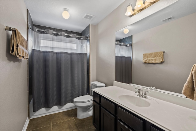 bathroom featuring toilet, shower / tub combo, tile patterned flooring, and visible vents