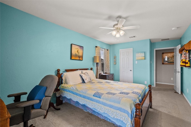 carpeted bedroom featuring baseboards, visible vents, and ceiling fan