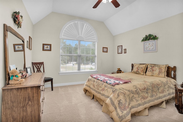 carpeted bedroom with baseboards, a ceiling fan, and vaulted ceiling