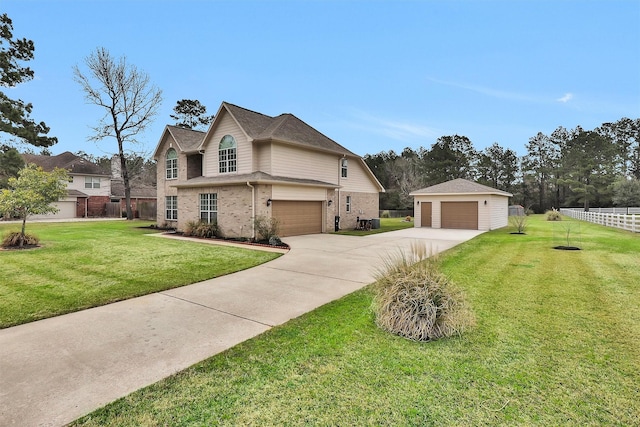 view of front facade with brick siding, fence, a front yard, a garage, and an outbuilding