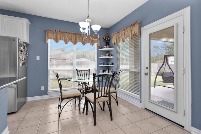 dining room with baseboards, an inviting chandelier, and light tile patterned flooring