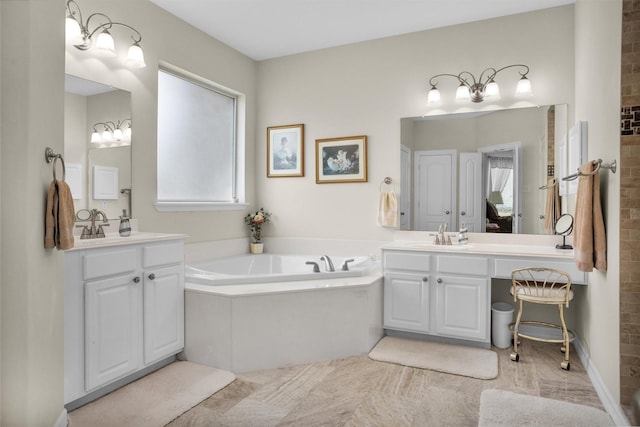 bathroom with a sink, two vanities, and a bath