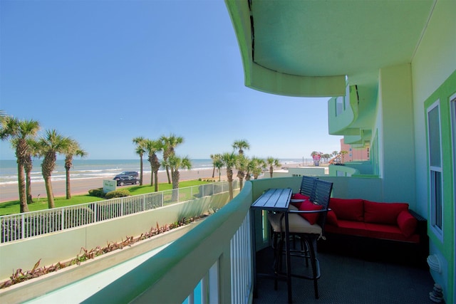 balcony featuring a water view