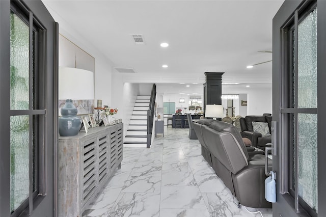 living area featuring stairway, recessed lighting, visible vents, and marble finish floor