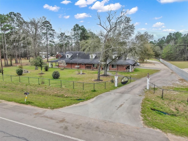 exterior space featuring driveway and a gated entry