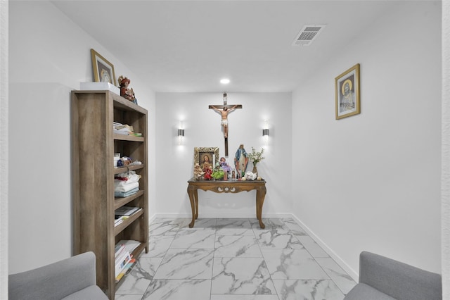 corridor with recessed lighting, visible vents, marble finish floor, and baseboards