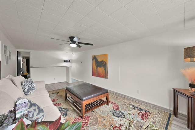 living room featuring wood finished floors and ceiling fan