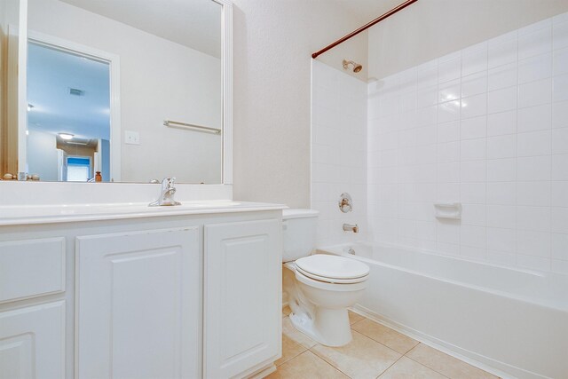 full bath with tile patterned flooring, toilet, visible vents, vanity, and shower / bathing tub combination