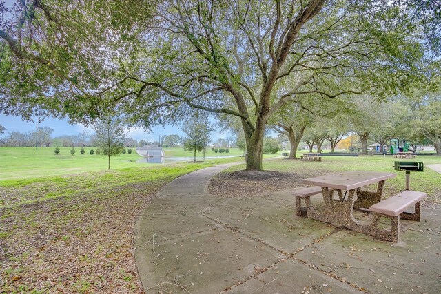 view of home's community with a lawn