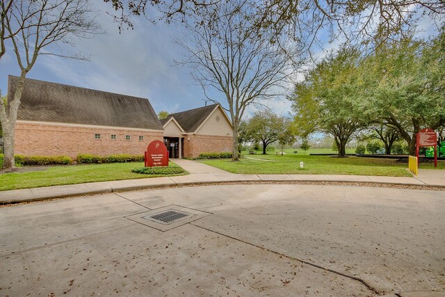 surrounding community featuring a lawn