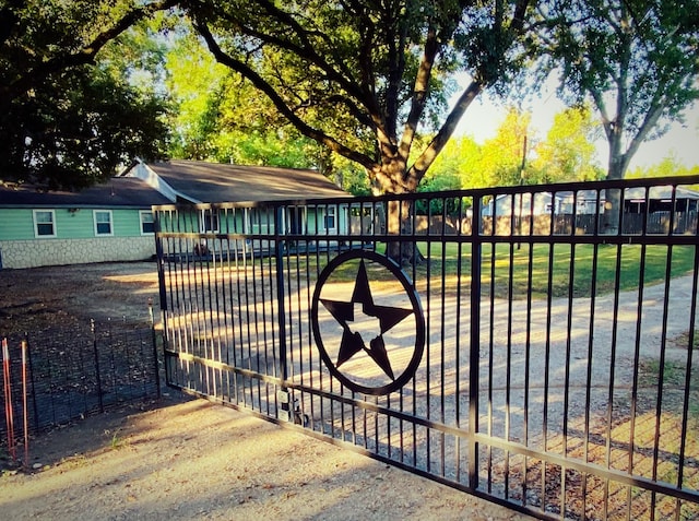 view of gate with fence