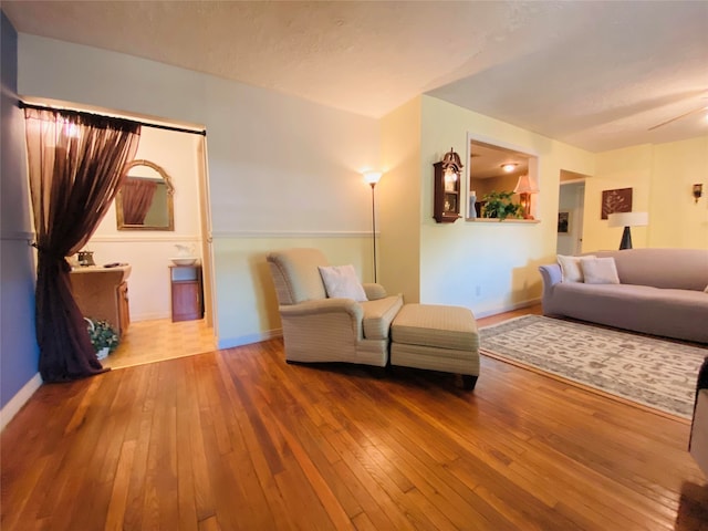 living room with baseboards and hardwood / wood-style flooring