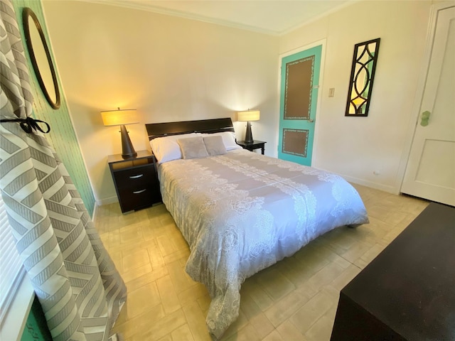 bedroom with baseboards and crown molding