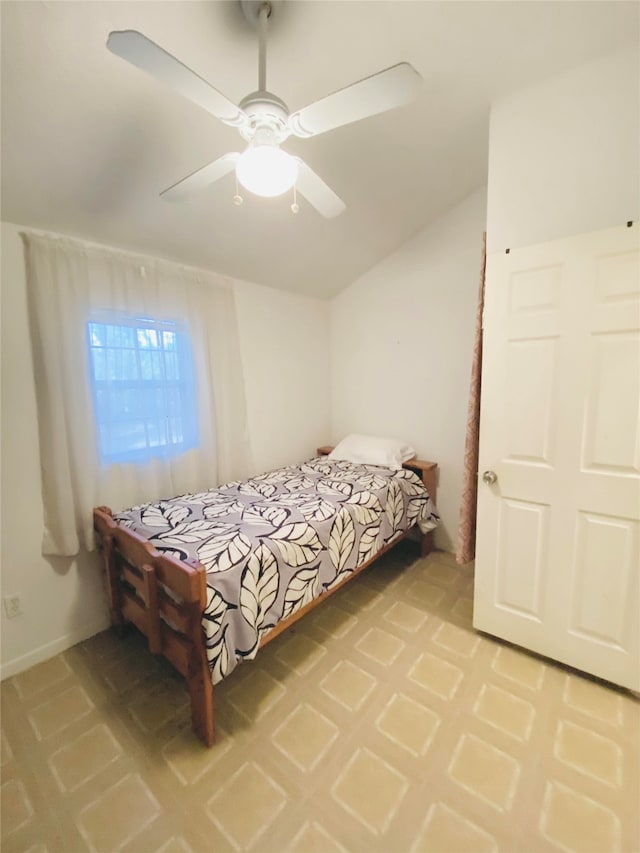 bedroom featuring lofted ceiling and a ceiling fan