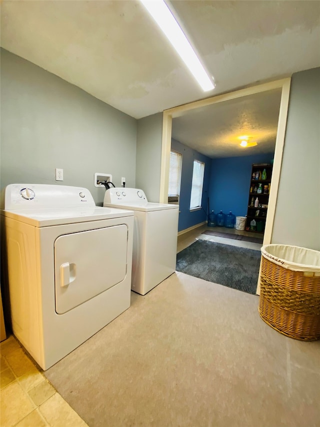 clothes washing area with laundry area and washer and dryer