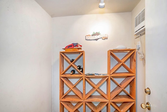 wine room with a wall mounted AC