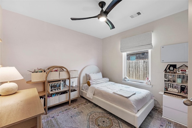 bedroom with visible vents and a ceiling fan