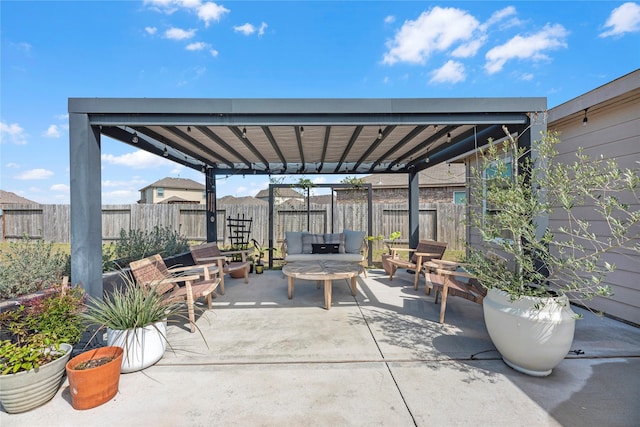 view of patio featuring a fenced backyard and an outdoor living space