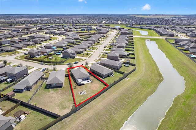 bird's eye view featuring a residential view and a water view