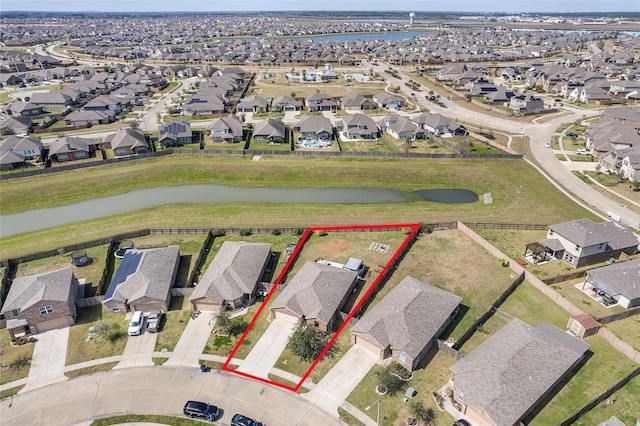 bird's eye view featuring a residential view and a water view