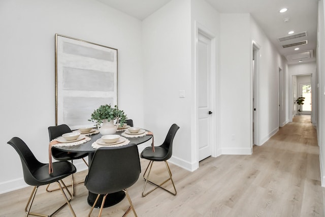 dining area with light wood-type flooring, visible vents, baseboards, and recessed lighting