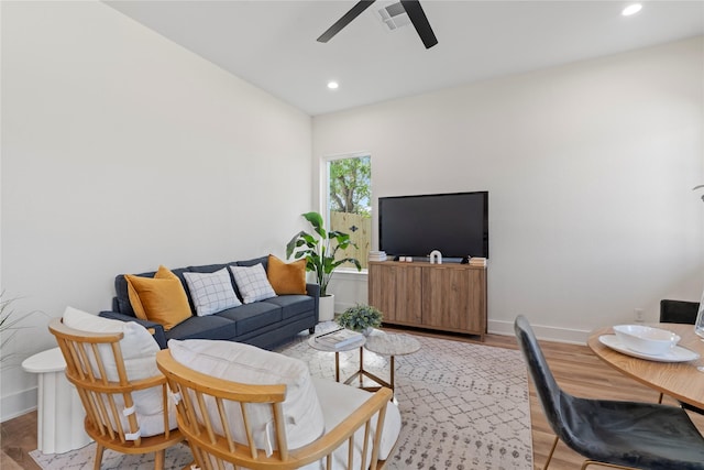 living area with baseboards, recessed lighting, visible vents, and a ceiling fan